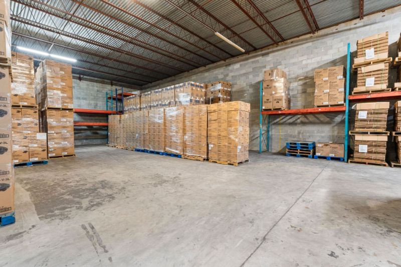 Warehouse interior at 1030 SE 4th Street with high ceilings and clear-span steel trusses