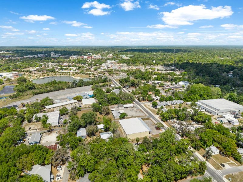 Aerial view of the warehouse at 1030 SE 4th Street with downtown Gainesville in the background